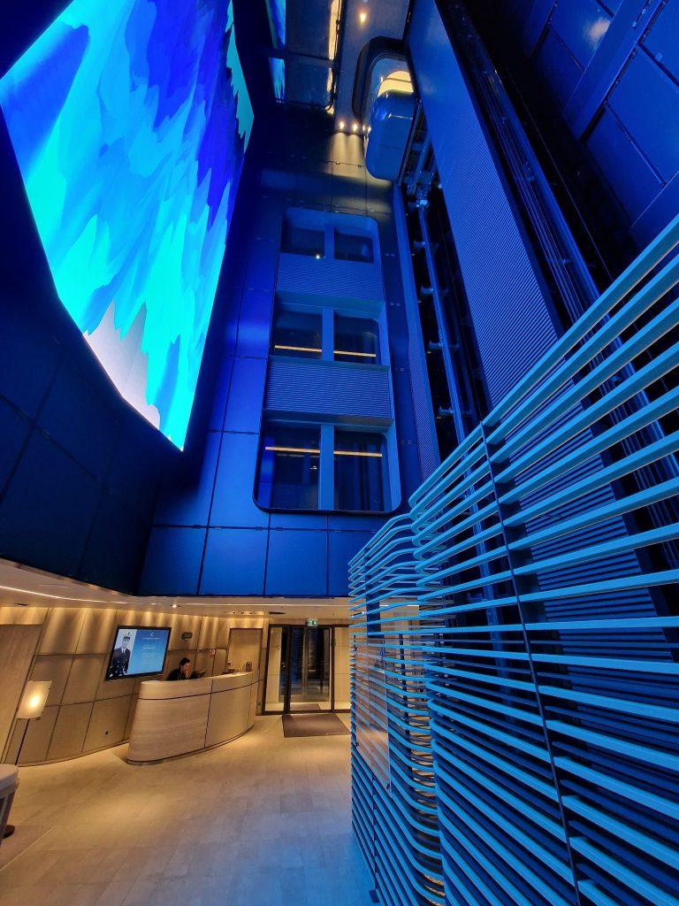 The enormous blue-lit atrium