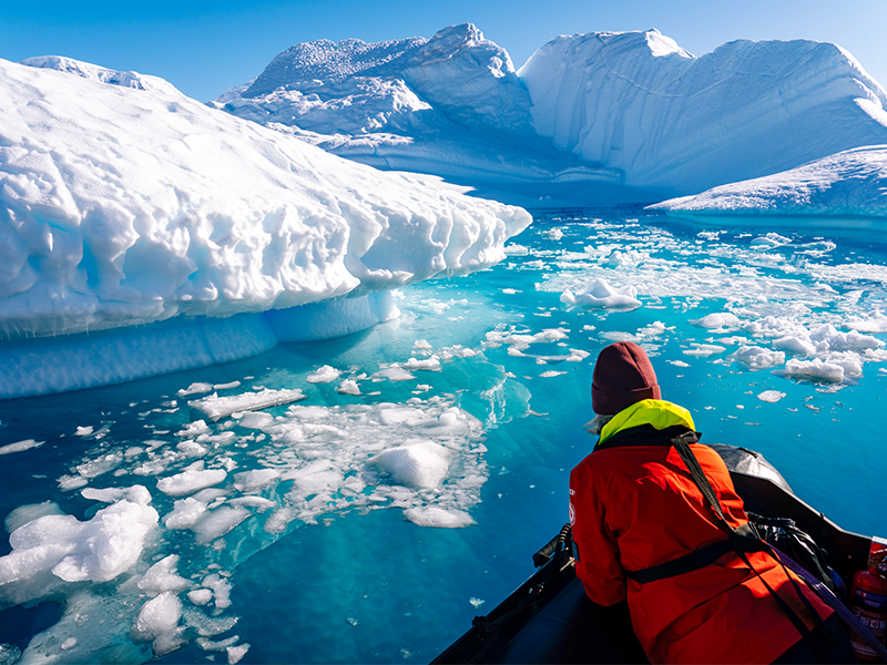 Expedition boat cruising in Neko Harbour, Antarctica.
