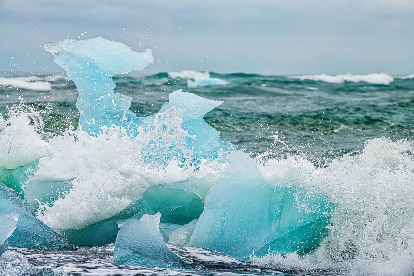Waves crashing on Jokulsarlon Diamond Ice glacial beach in Iceland